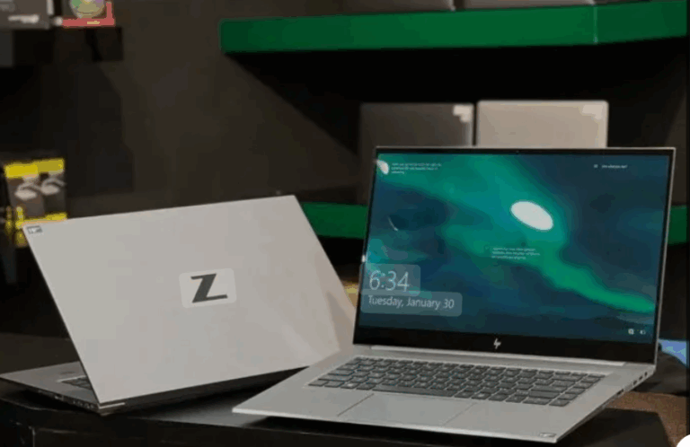 HP ZBook 15 G8 workstation laptop open and closed on a display table with backlit keyboard and vivid screen